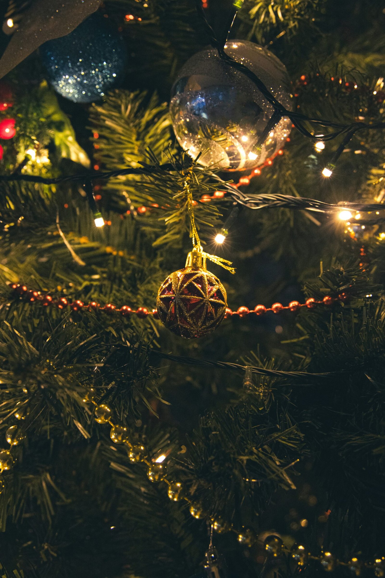 a close up of a christmas tree with ornaments